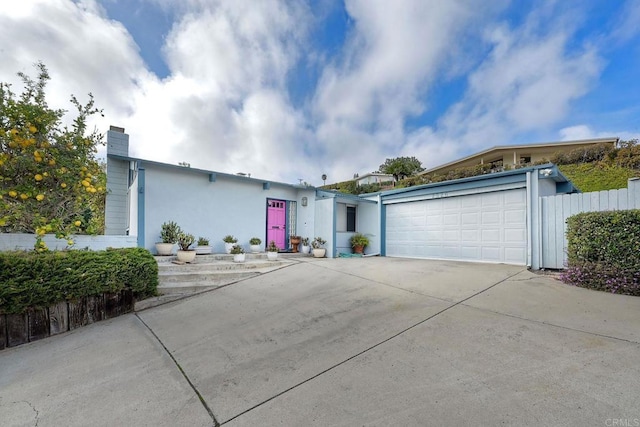 ranch-style house featuring a garage