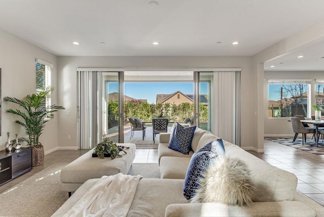 tiled living room with a healthy amount of sunlight