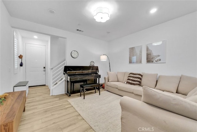 living room with light hardwood / wood-style flooring