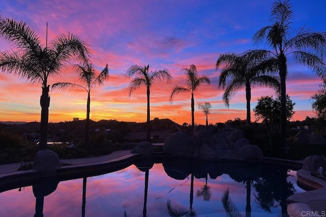 view of pool at dusk