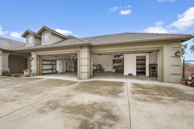 garage with concrete driveway