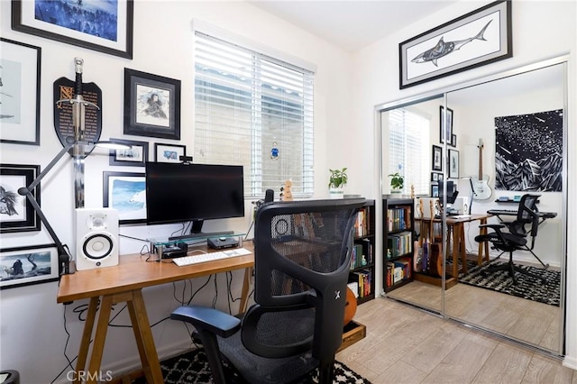 office space with light hardwood / wood-style flooring