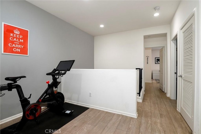 exercise area featuring light wood-type flooring