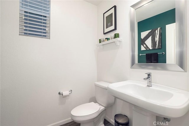 bathroom with sink and toilet