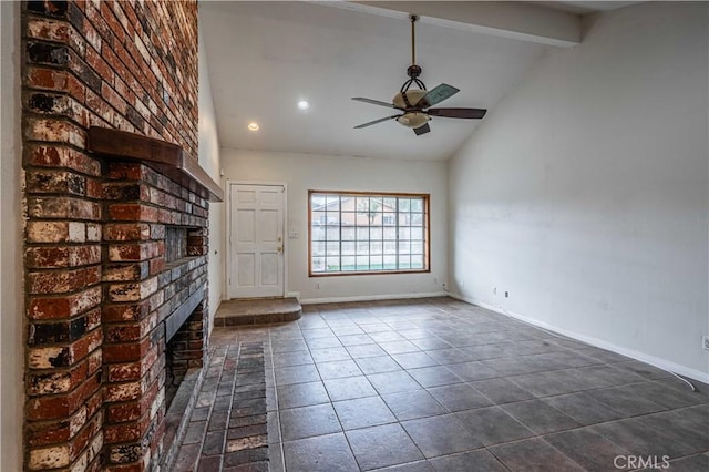 unfurnished living room featuring high vaulted ceiling, beamed ceiling, dark tile patterned flooring, ceiling fan, and a brick fireplace