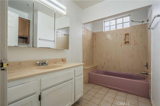 bathroom featuring vanity, tile patterned floors, and washtub / shower combination