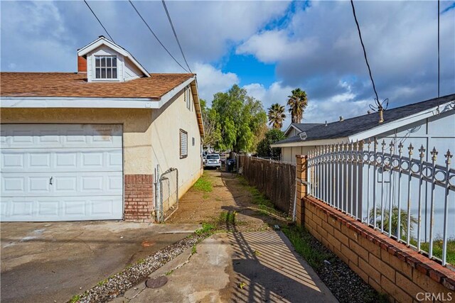 view of side of property featuring a garage