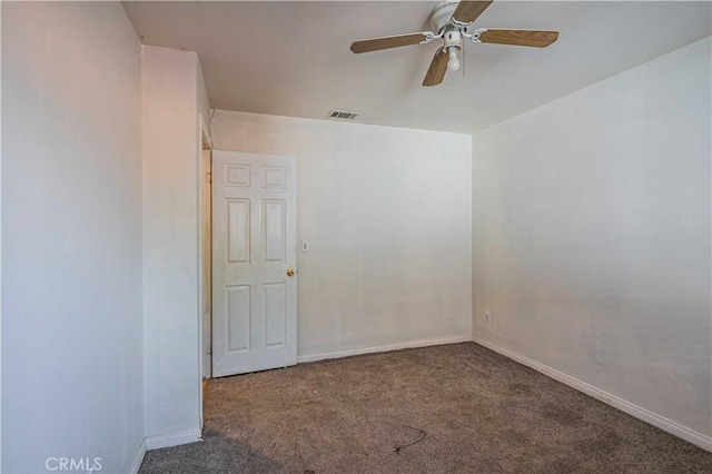 empty room featuring carpet flooring and ceiling fan