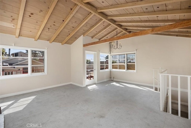 carpeted spare room featuring a chandelier, lofted ceiling with beams, and wooden ceiling