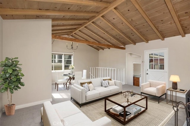 living room with an inviting chandelier, vaulted ceiling with beams, wood ceiling, and carpet flooring