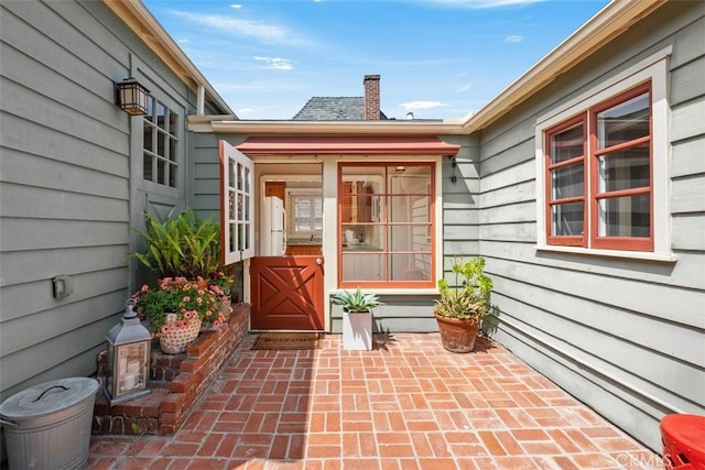 551 Anita St, Laguna Beach, CA 92651 - property entrance featuring a chimney and a patio area