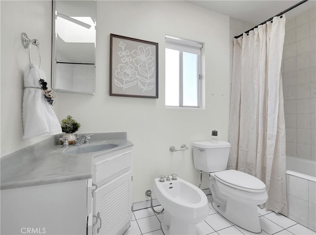 full bathroom featuring a bidet, vanity, tile patterned floors, toilet, and tiled shower / bath combo