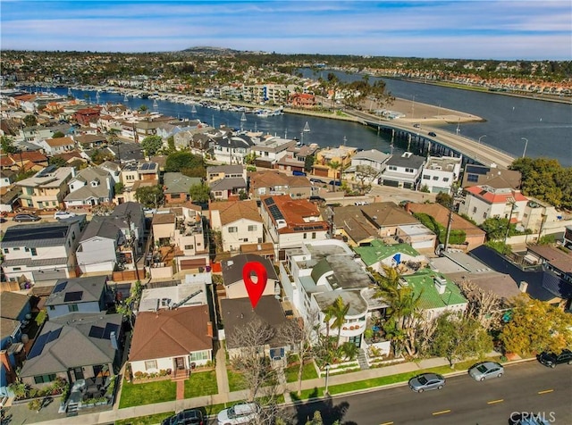 aerial view featuring a residential view and a water view