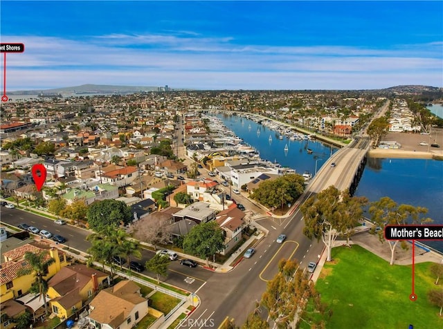 birds eye view of property featuring a water view and a residential view