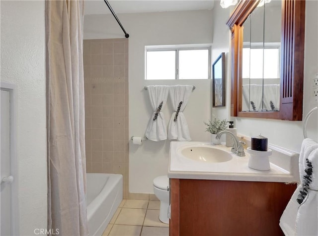 full bath with tile patterned floors, shower / tub combo, vanity, and toilet