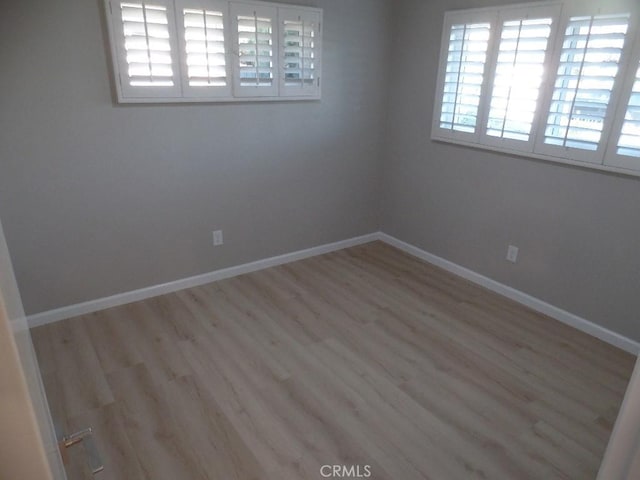 unfurnished room featuring light hardwood / wood-style flooring