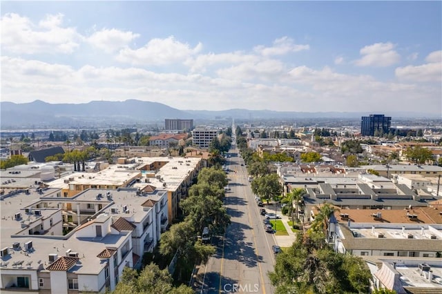 birds eye view of property with a mountain view