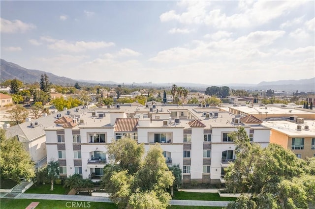 birds eye view of property with a mountain view