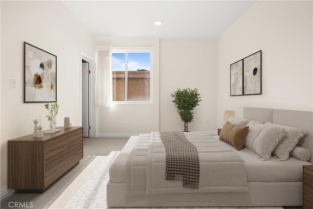 bedroom featuring light colored carpet