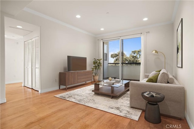 living room with crown molding and wood-type flooring