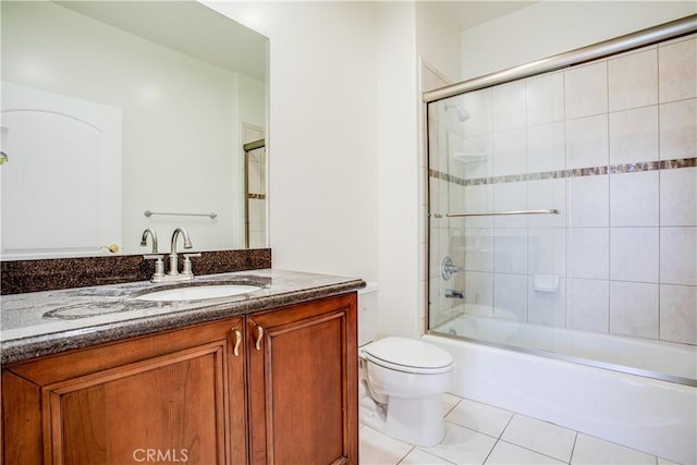 full bathroom with vanity, toilet, tile patterned floors, and tiled shower / bath