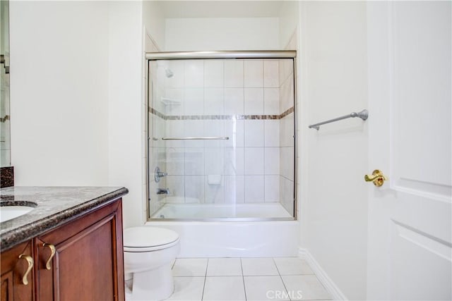 full bathroom featuring tile patterned flooring, vanity, shower / bath combination with glass door, and toilet