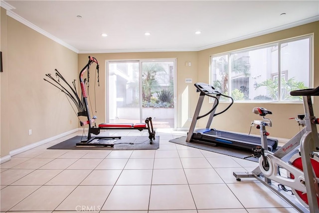 exercise area featuring crown molding and light tile patterned floors