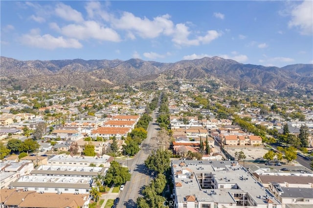 birds eye view of property with a mountain view