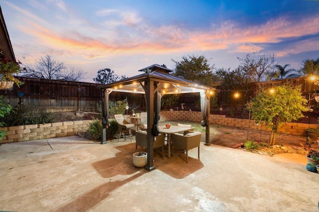 patio terrace at dusk with a gazebo