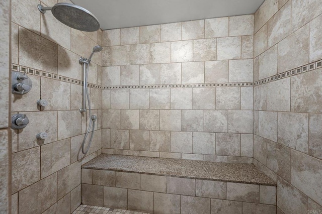 bathroom featuring a tile shower