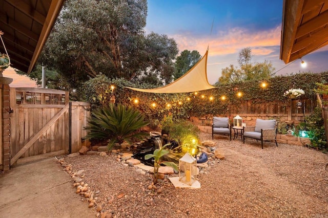 yard at dusk with a patio