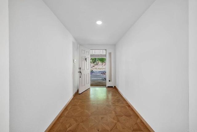 hallway featuring baseboards