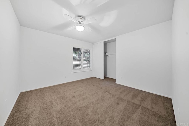 unfurnished bedroom featuring ceiling fan, carpet floors, and a closet