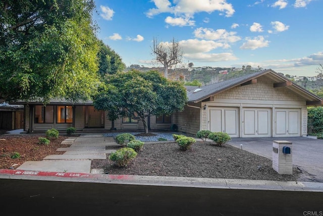 view of front of property featuring driveway and an attached garage