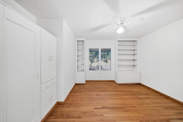 spacious closet featuring light wood finished floors and a ceiling fan