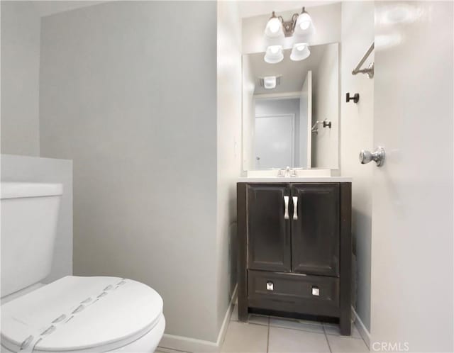 bathroom featuring tile patterned floors, vanity, and toilet