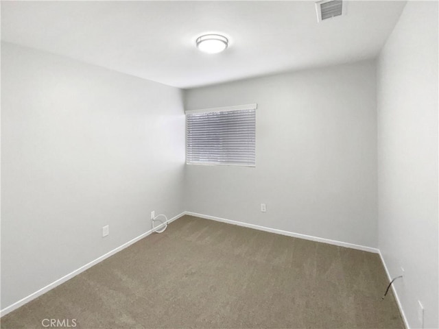 spare room featuring carpet flooring