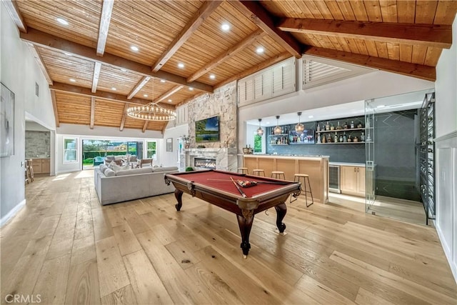 game room featuring wooden ceiling, light wood finished floors, beamed ceiling, and high vaulted ceiling
