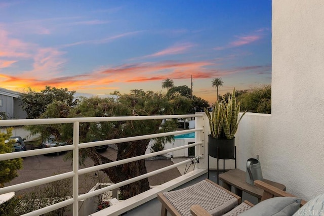 view of balcony at dusk