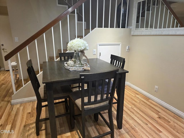 dining room with hardwood / wood-style flooring