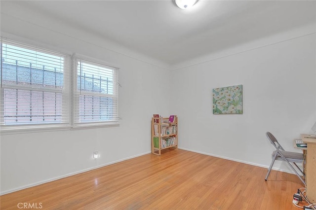 interior space with light wood-type flooring and baseboards