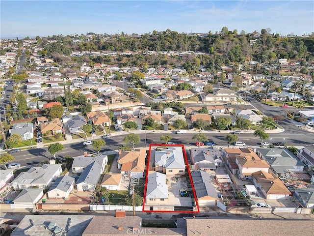 birds eye view of property with a residential view