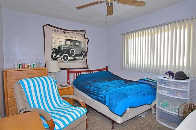 carpeted bedroom featuring a ceiling fan