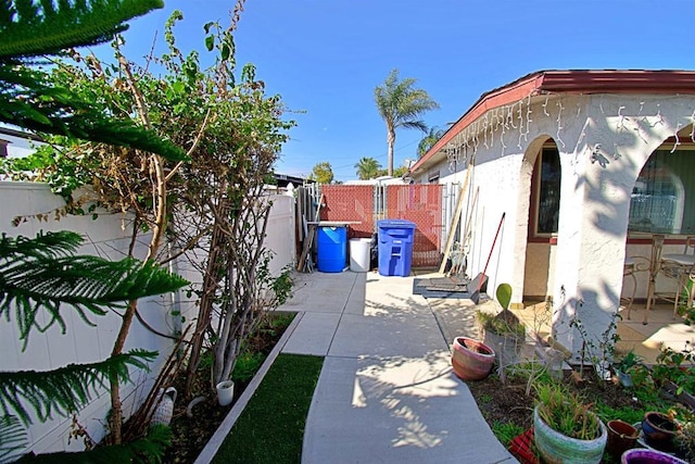view of property exterior featuring a patio area, a fenced backyard, and stucco siding