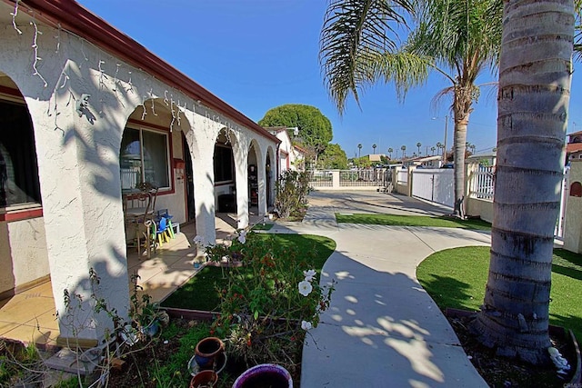 view of patio featuring fence