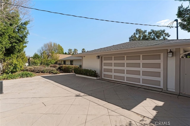 view of side of property featuring a garage