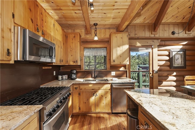 kitchen with hanging light fixtures, wood ceiling, stainless steel appliances, and sink