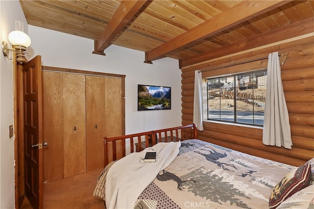 bedroom featuring beamed ceiling, carpet flooring, and wooden ceiling