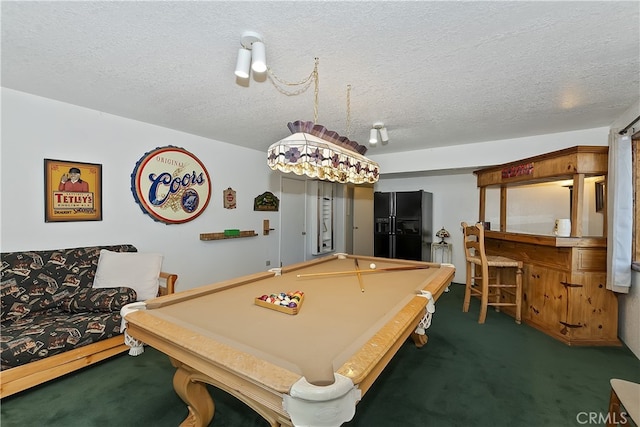 rec room featuring pool table, a textured ceiling, and dark colored carpet