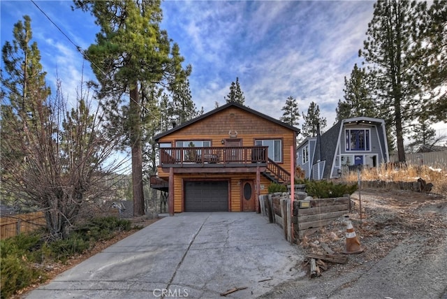 view of front facade featuring a garage and a deck